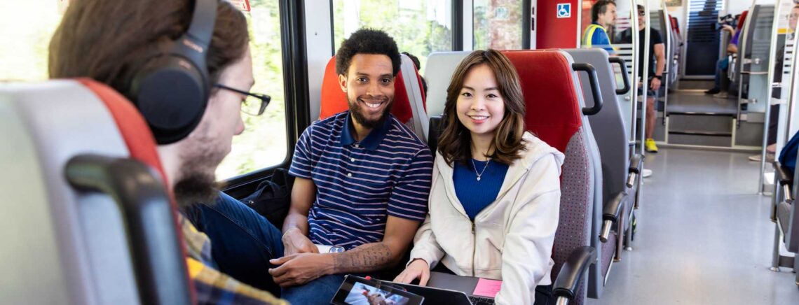 ACC students pose during a northbound CapMetro train ride from Highland to Leander on Friday, March 24, 2023 during a staged photo shoot organized by the Office of College Relations and Marketing.