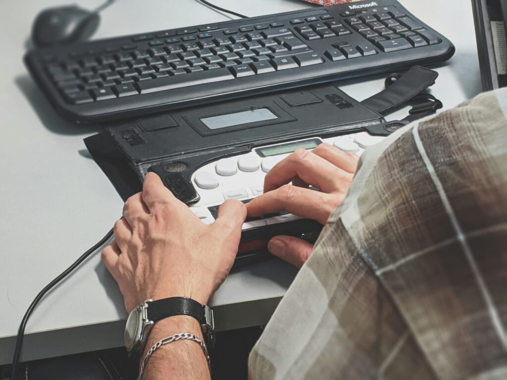 Image of person with a accessible keyboard