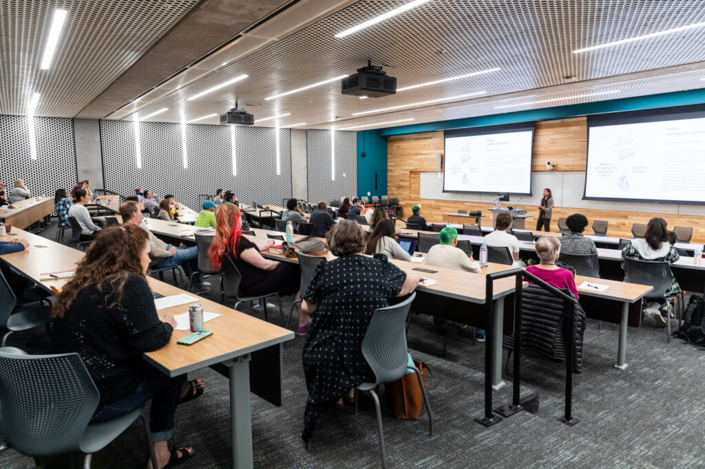 Image of people attending a talk.
